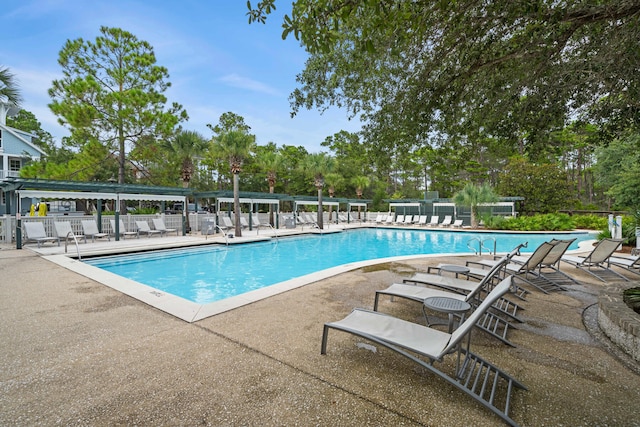 view of swimming pool with a patio area