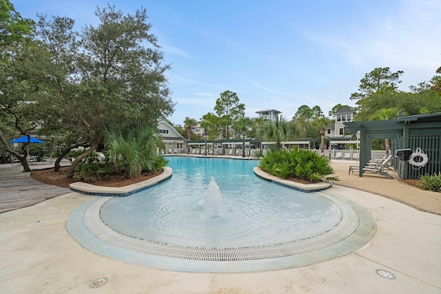 view of swimming pool featuring pool water feature