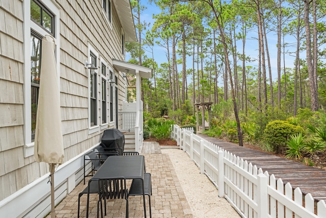 view of patio featuring a grill