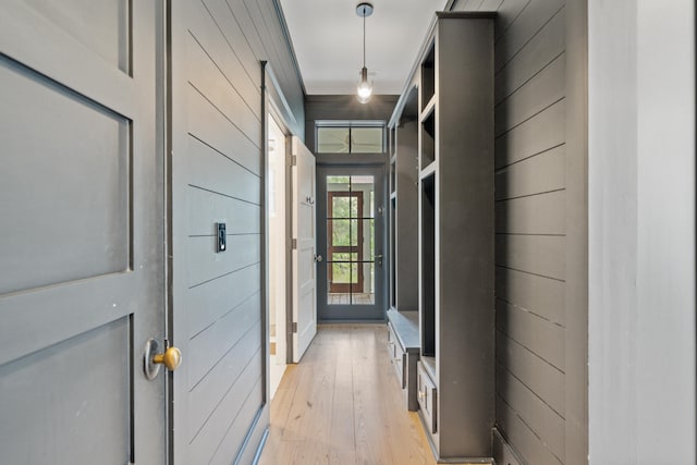 corridor with light hardwood / wood-style flooring