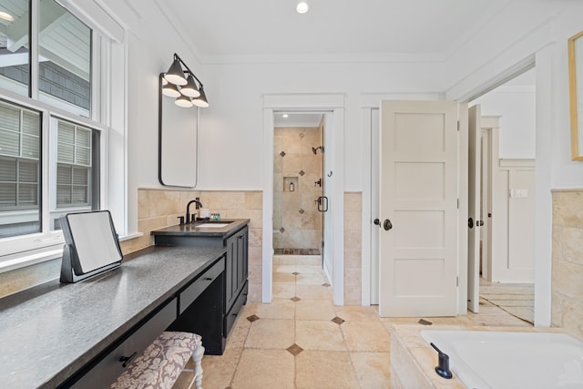 bathroom with vanity, plus walk in shower, crown molding, and a healthy amount of sunlight