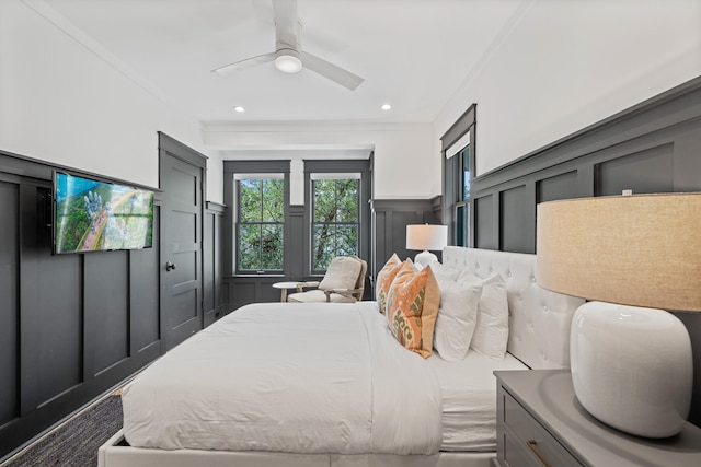 bedroom featuring ceiling fan and crown molding