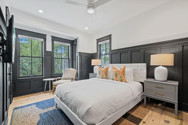 bedroom with ceiling fan and light wood-type flooring