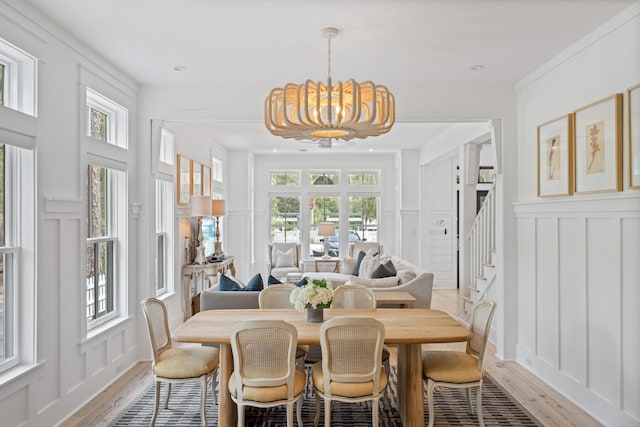 interior space with plenty of natural light and an inviting chandelier