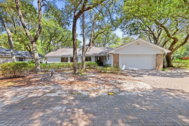 single story home featuring a garage