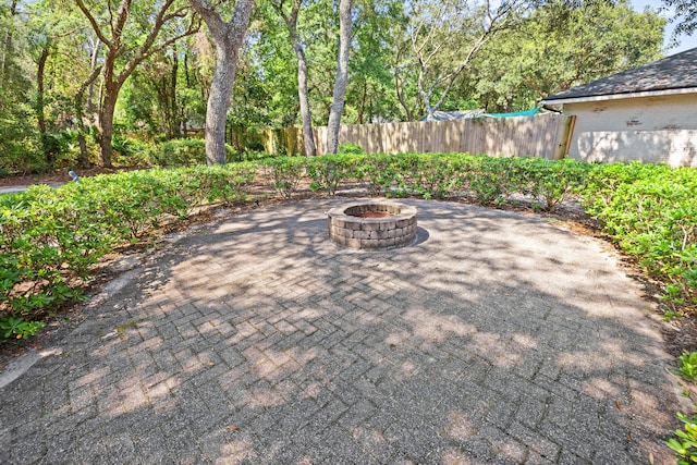 view of patio / terrace with an outdoor fire pit