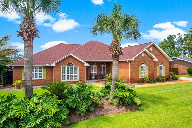 single story home with a front yard