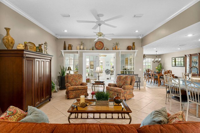 living room with light tile patterned flooring, ceiling fan, and ornamental molding