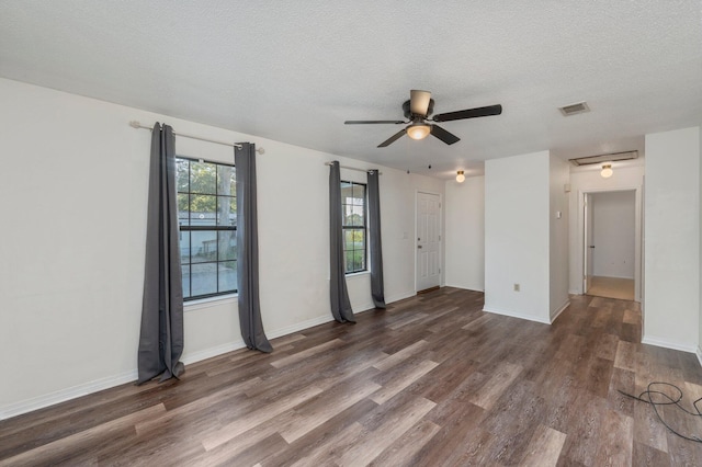 5793 New York St, Baker, FL 32531 - unfurnished room with visible vents, a textured ceiling, wood finished floors, and a ceiling fan