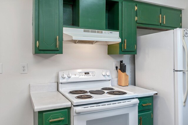 kitchen with green cabinets, extractor fan, and white appliances