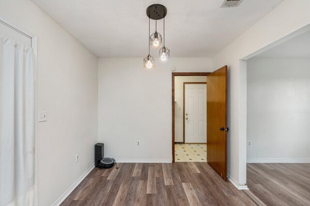 spare room featuring hardwood / wood-style floors