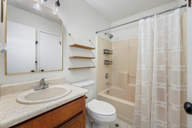 full bathroom featuring shower / bathtub combination with curtain, vanity, a textured ceiling, toilet, and tile patterned floors