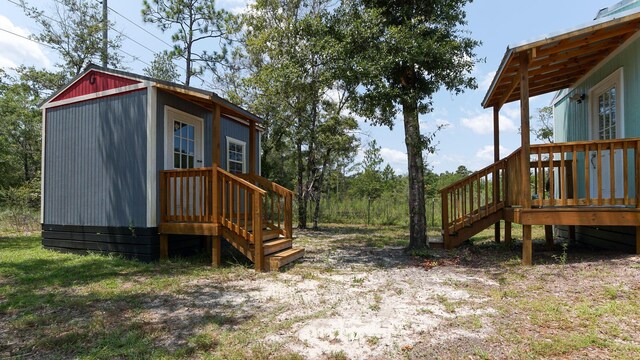 view of yard with an outdoor structure and a deck