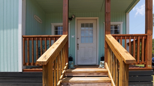 entrance to property featuring a porch