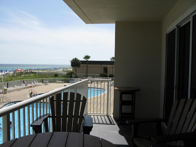 balcony featuring a water view