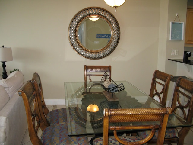 dining area with tile patterned flooring