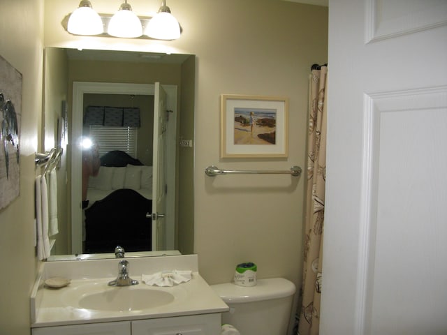 bathroom with vanity and toilet