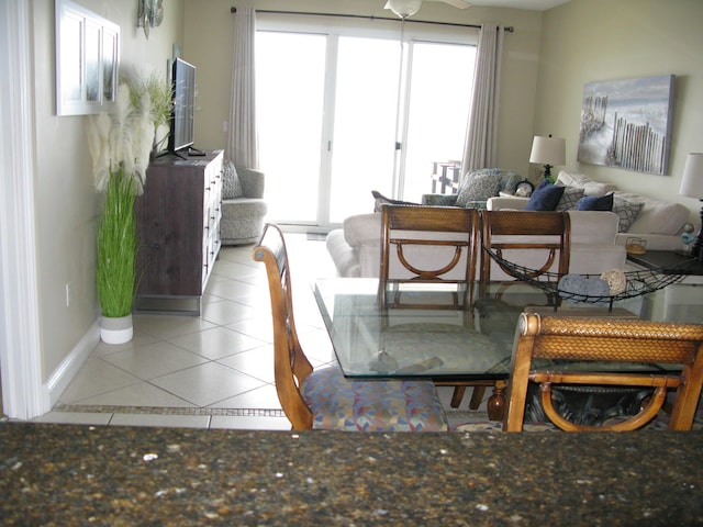 living room featuring a healthy amount of sunlight and light tile patterned floors