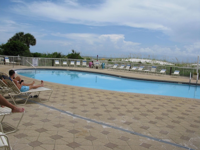 view of swimming pool with a patio