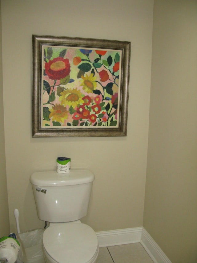 bathroom featuring toilet and tile patterned flooring