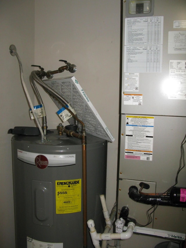 utility room with water heater and heating unit