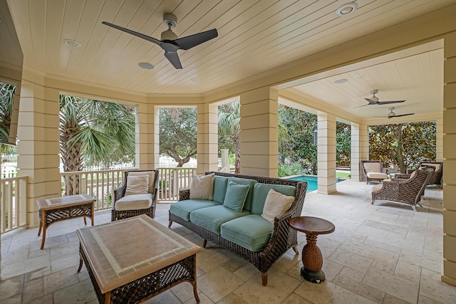 view of patio with a fenced in pool, a ceiling fan, and outdoor lounge area