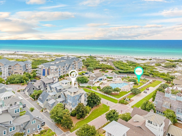 bird's eye view featuring a view of the beach and a water view