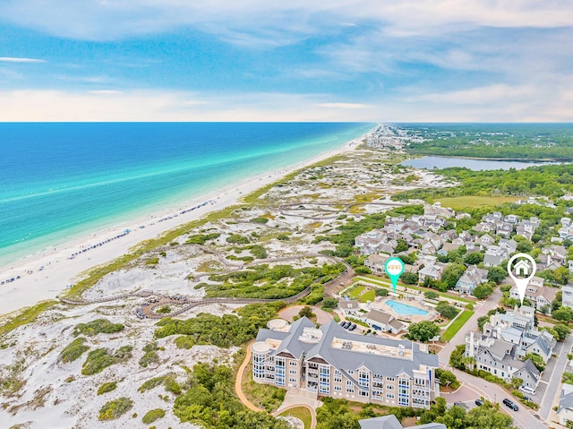 birds eye view of property featuring a view of the beach and a water view