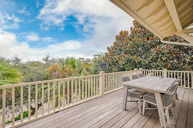 wooden deck featuring outdoor dining space