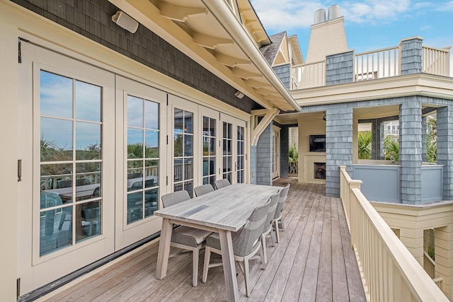 deck featuring french doors and outdoor dining area