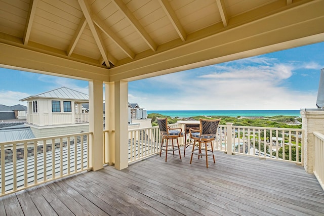 wooden deck with a water view