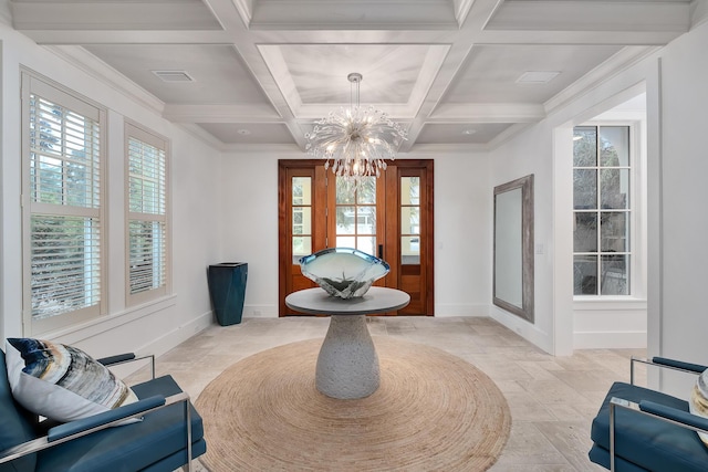 sitting room with a notable chandelier, coffered ceiling, baseboards, and a wealth of natural light