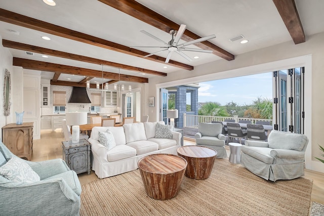 living area featuring visible vents, beam ceiling, recessed lighting, light wood-style floors, and ceiling fan