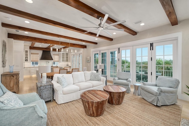 living area featuring recessed lighting, a healthy amount of sunlight, visible vents, and ceiling fan