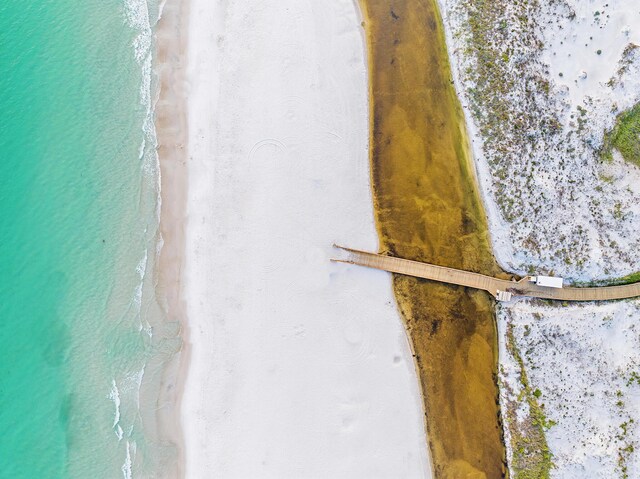 aerial view with a beach view and a water view