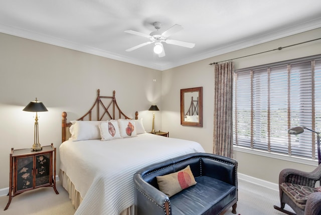 carpeted bedroom featuring ornamental molding and ceiling fan