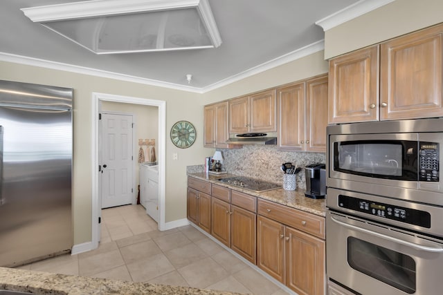 kitchen featuring decorative backsplash, built in appliances, light tile patterned floors, crown molding, and light stone countertops