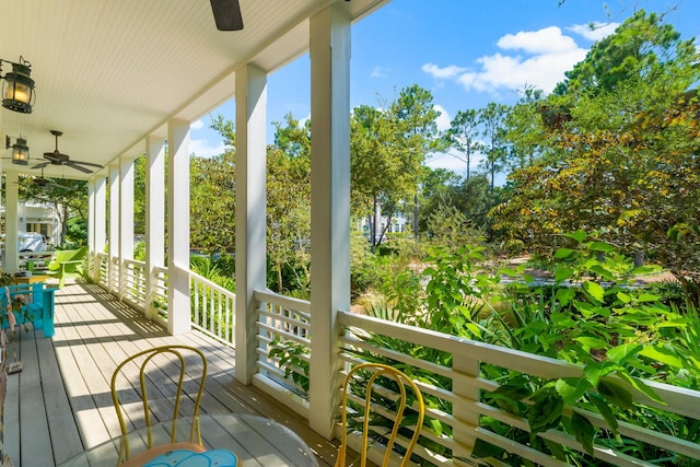 deck with covered porch and ceiling fan