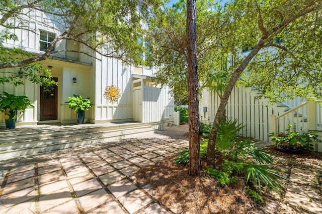 view of yard featuring a balcony and a patio