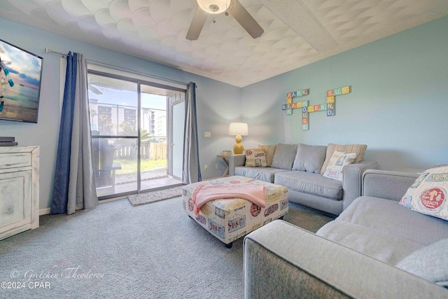 carpeted living room with ceiling fan