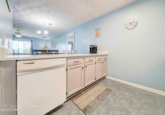 kitchen with white cabinets, pendant lighting, tile patterned flooring, kitchen peninsula, and dishwasher