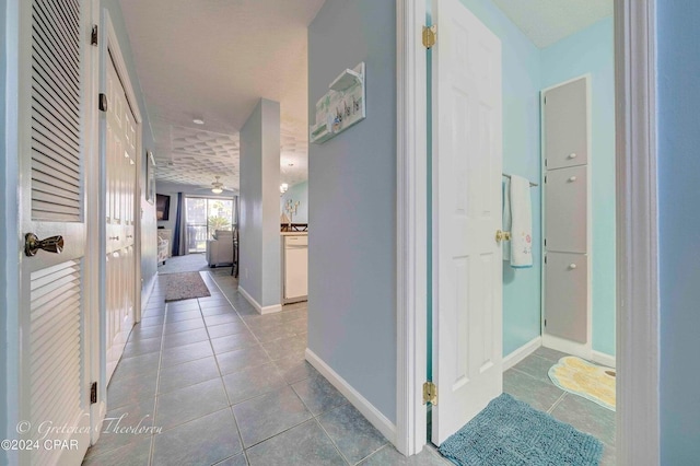 corridor featuring tile patterned flooring