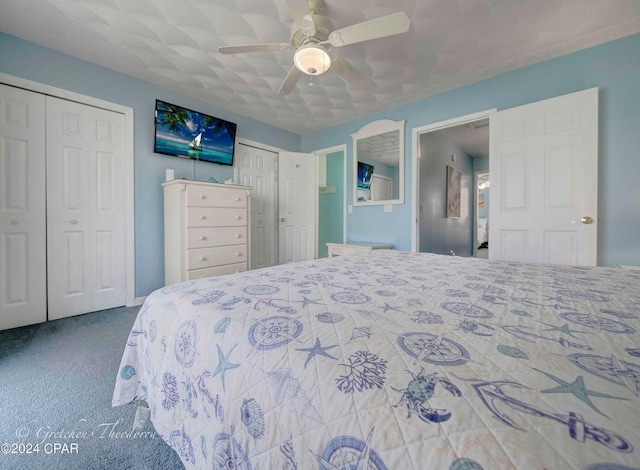 bedroom featuring two closets, carpet floors, and ceiling fan