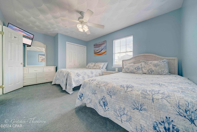 bedroom featuring carpet, a closet, and ceiling fan