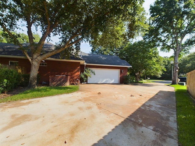 view of property exterior with a garage