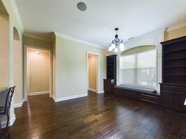 interior space with crown molding, dark wood-type flooring, and a chandelier