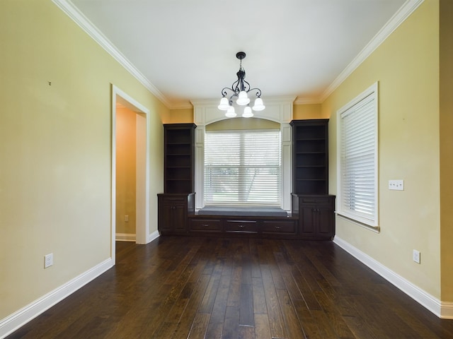 unfurnished dining area featuring a notable chandelier, dark wood-type flooring, and crown molding