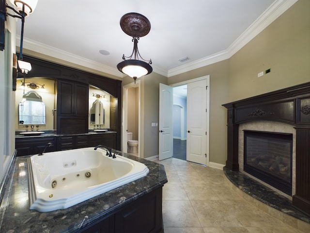 bathroom with vanity, crown molding, and tile patterned flooring