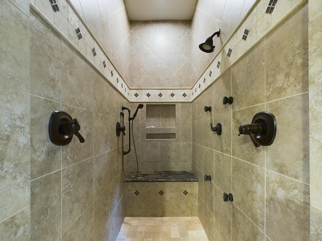 bathroom with tiled shower