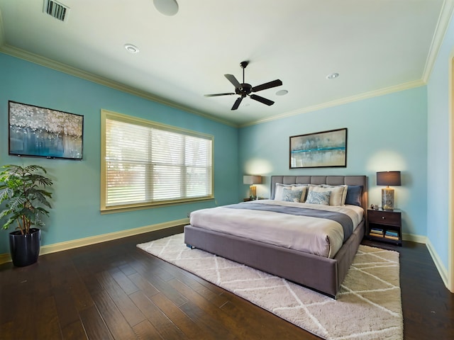 bedroom featuring crown molding, hardwood / wood-style floors, and ceiling fan